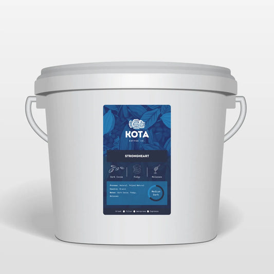 White container with a blue label featuring 'Kota Coffee Co.' on a white background